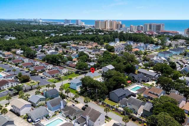 713 9th Ave S, North Myrtle Beach, SC 29582 - aerial overview of property's location with a nearby body of water and nearby urban area