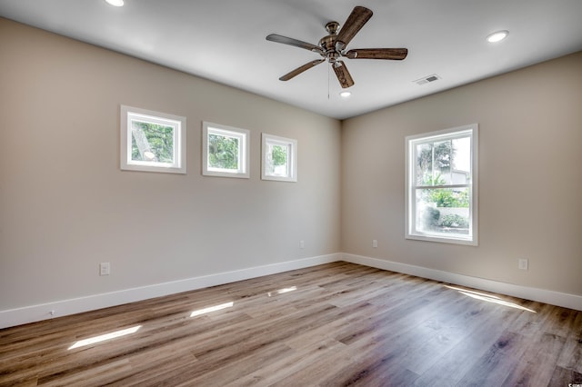 unfurnished room featuring ceiling fan and light hardwood / wood-style flooring