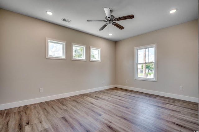 unfurnished room with ceiling fan and light hardwood / wood-style flooring