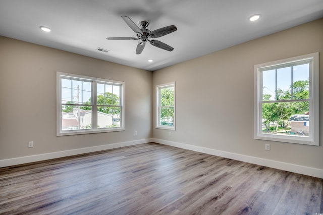 spare room with ceiling fan and light hardwood / wood-style floors