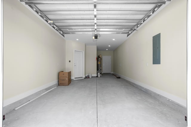 713 9th Ave S, North Myrtle Beach, SC 29582 - garage with electric panel, electric water heater, and a garage door opener