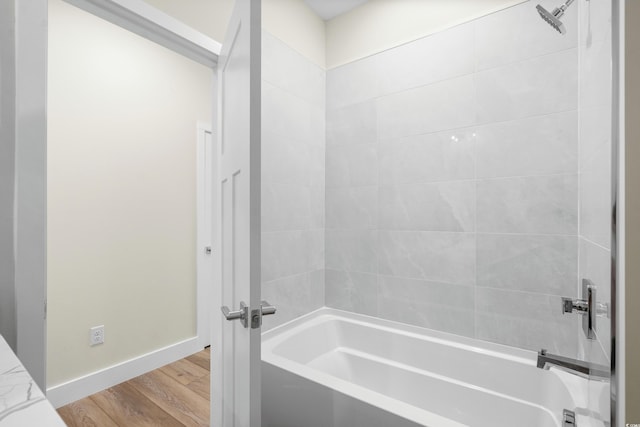 713 9th Ave S, North Myrtle Beach, SC 29582 - bathroom featuring shower / tub combination and wood finished floors