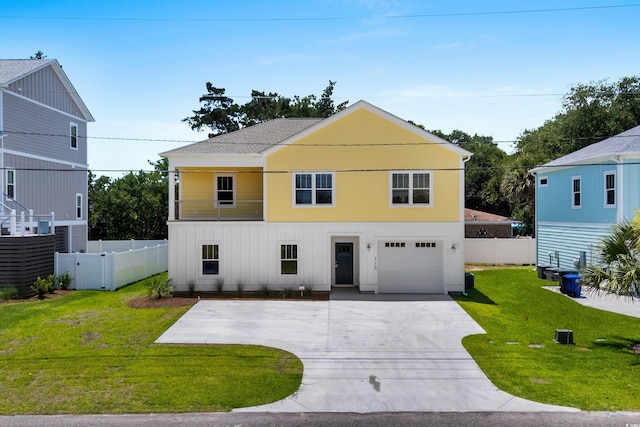 713 9th Ave S, North Myrtle Beach, SC 29582 - view of front of house featuring concrete driveway, an attached garage, and board and batten siding