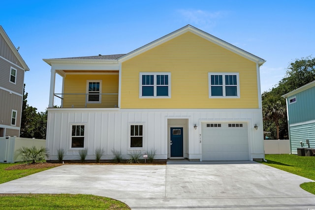 713 9th Ave S, North Myrtle Beach, SC 29582 - view of front of house featuring board and batten siding, a garage, and driveway