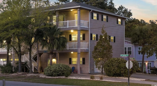 view of front of home featuring a balcony