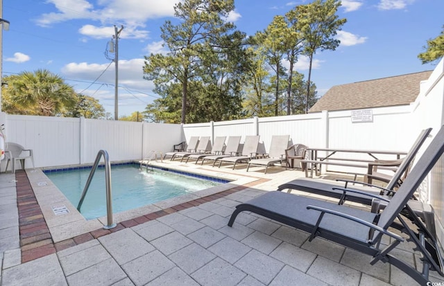 view of swimming pool featuring a patio