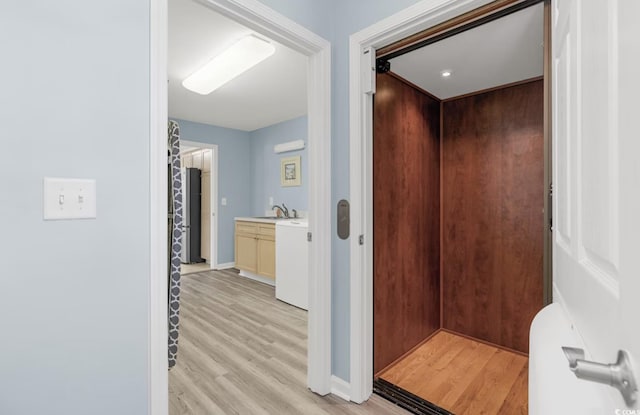 bathroom featuring vanity and hardwood / wood-style floors