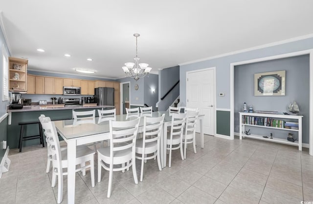 dining room with ornamental molding, light tile patterned flooring, and a notable chandelier