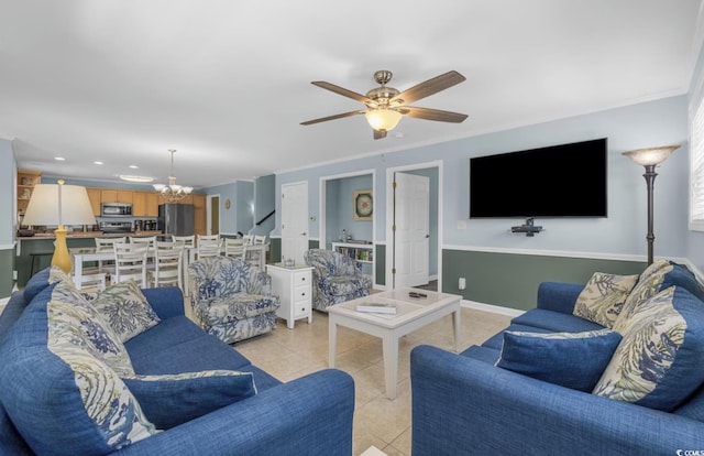 living room with ceiling fan with notable chandelier, light tile patterned floors, and ornamental molding