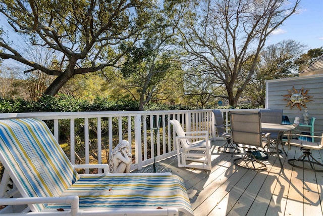 deck featuring outdoor dining area