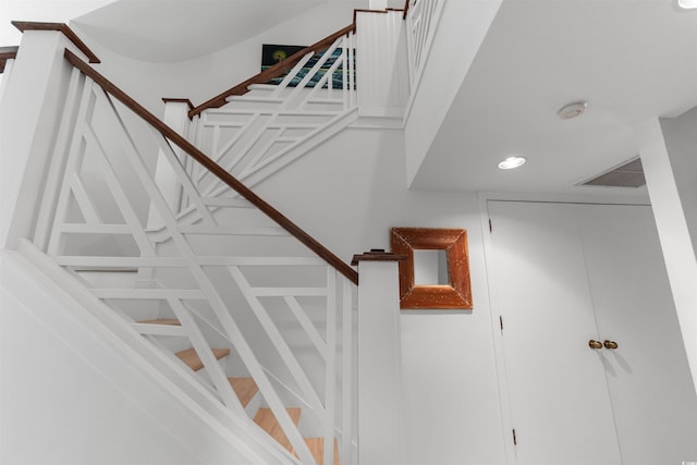 stairs with recessed lighting and visible vents