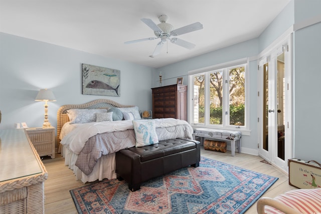 bedroom with a ceiling fan and light wood-style floors