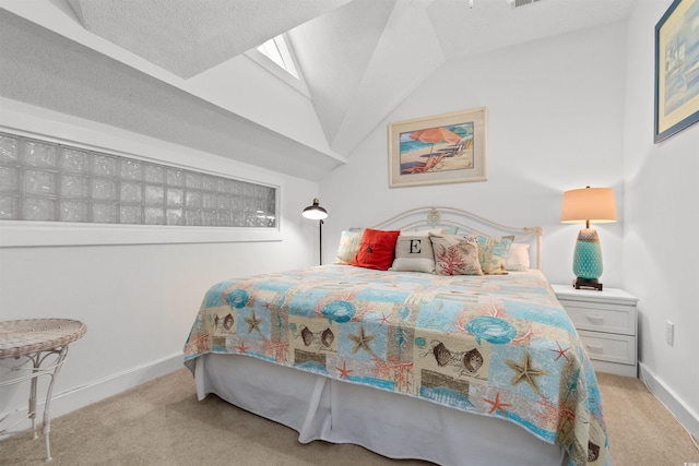 bedroom with vaulted ceiling, carpet floors, and baseboards