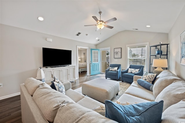 living room with light wood finished floors, baseboards, visible vents, and vaulted ceiling