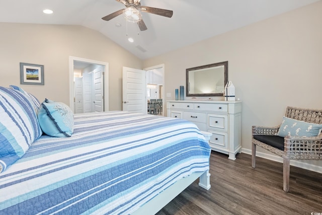 bedroom with ensuite bathroom, a ceiling fan, baseboards, vaulted ceiling, and dark wood-style floors