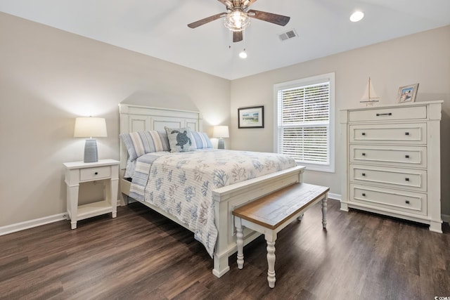 bedroom with a ceiling fan, dark wood-style flooring, visible vents, and baseboards