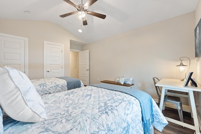 bedroom featuring lofted ceiling, dark wood-style flooring, and a ceiling fan