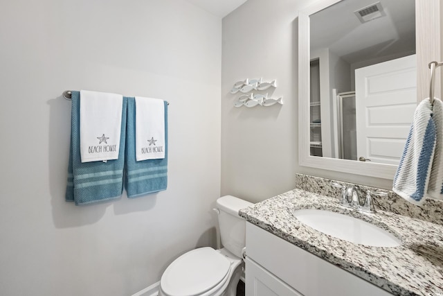 full bathroom with visible vents, toilet, vanity, and a shower stall