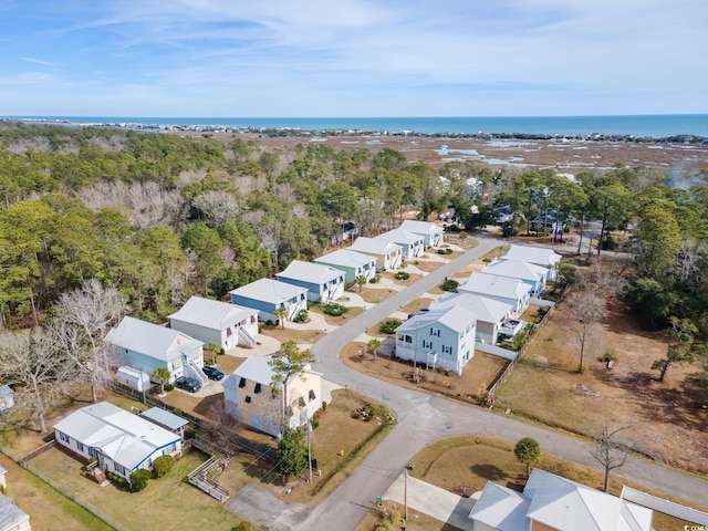 drone / aerial view featuring a water view and a residential view