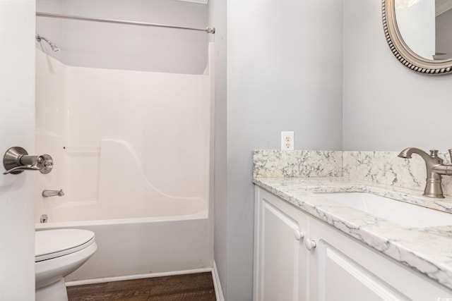 full bath featuring shower / washtub combination, vanity, and toilet