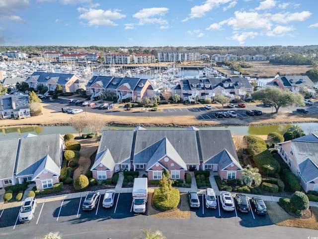 bird's eye view featuring a residential view and a water view