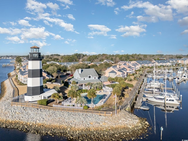 bird's eye view featuring a water view and a residential view