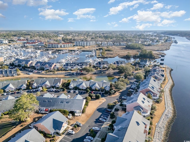 birds eye view of property with a residential view and a water view