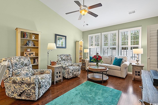 living area with ceiling fan, visible vents, high vaulted ceiling, and wood finished floors