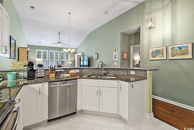 kitchen featuring visible vents, a sink, vaulted ceiling, appliances with stainless steel finishes, and pendant lighting