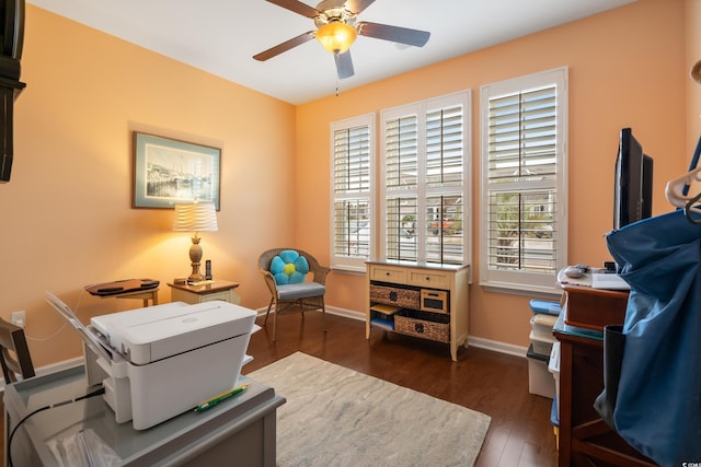 office space featuring wood finished floors, baseboards, and ceiling fan