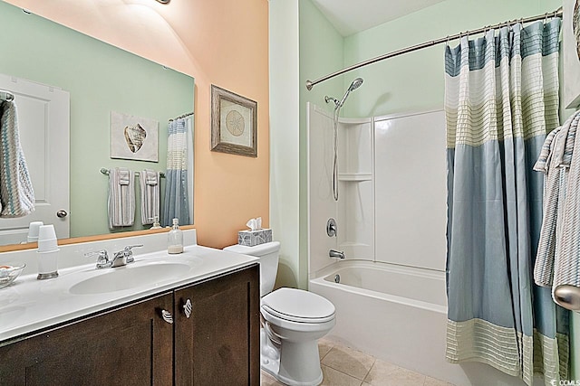 bathroom featuring tile patterned flooring, toilet, vanity, and shower / bath combo with shower curtain