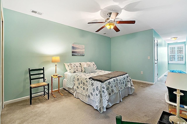 bedroom featuring visible vents, carpet floors, baseboards, and ceiling fan