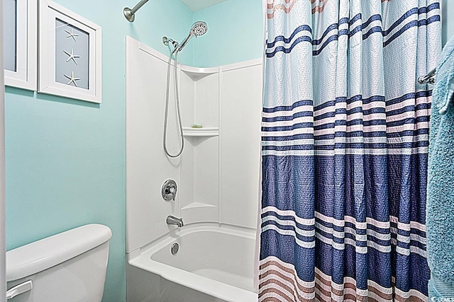 bathroom featuring toilet and shower / tub combo with curtain