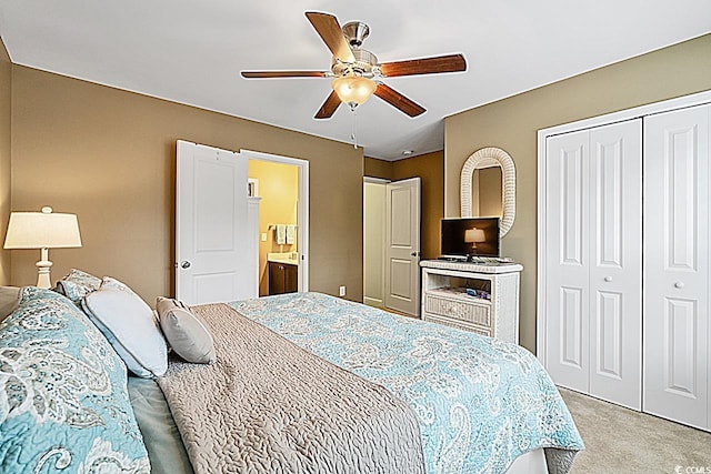 bedroom with light carpet, a ceiling fan, and a closet