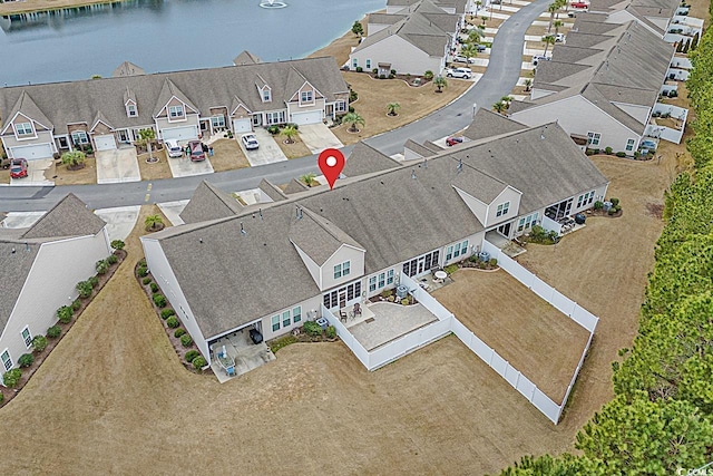 bird's eye view with a residential view and a water view