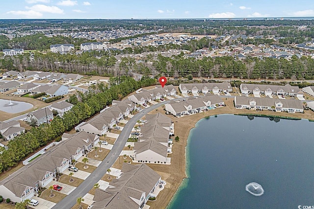 birds eye view of property with a residential view and a water view