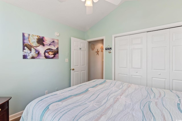 bedroom featuring a ceiling fan, lofted ceiling, and a closet