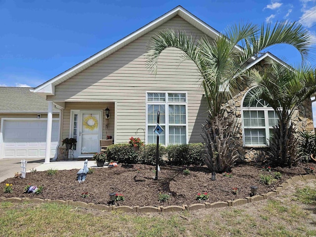 view of front of house with an attached garage and driveway