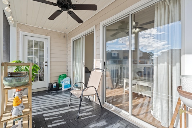 exterior space featuring ceiling fan