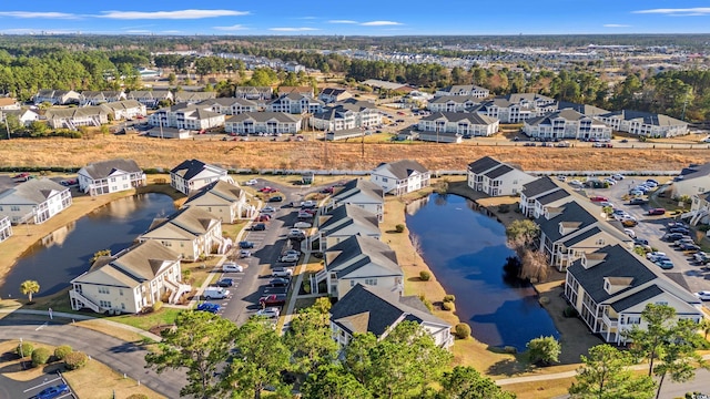 aerial view with a residential view and a water view