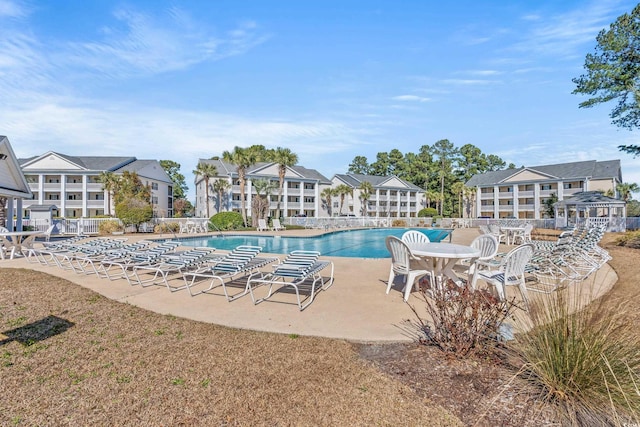 community pool featuring a patio area