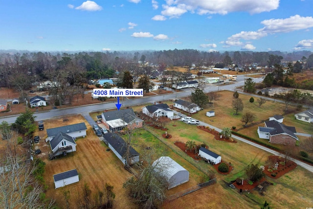 birds eye view of property with a residential view