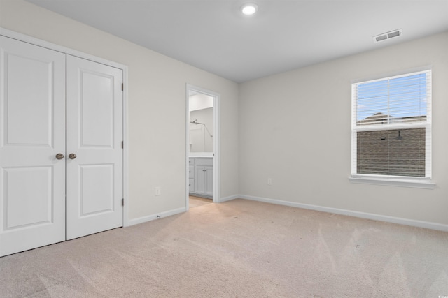 1043 Harbison Cir, Myrtle Beach, SC 29579 - unfurnished bedroom with baseboards, carpet floors, ensuite bathroom, and a closet