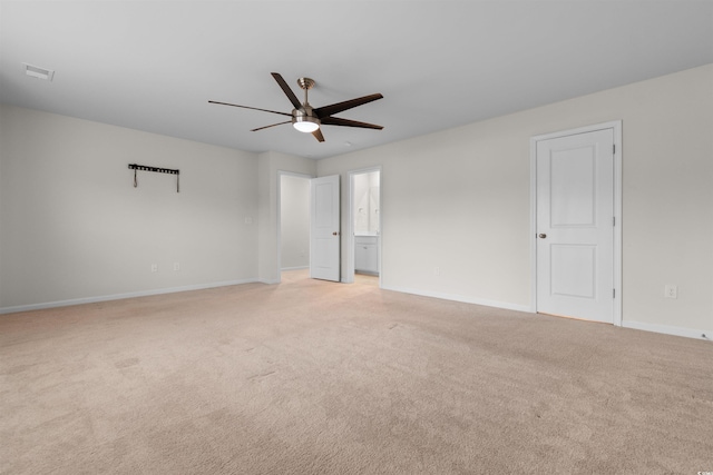 1043 Harbison Cir, Myrtle Beach, SC 29579 - unfurnished bedroom featuring light carpet, baseboards, ceiling fan, and ensuite bath