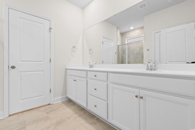 1043 Harbison Cir, Myrtle Beach, SC 29579 - bathroom featuring a shower stall, double vanity, and baseboards