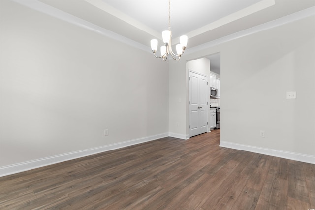 1043 Harbison Cir, Myrtle Beach, SC 29579 - empty room with a chandelier, a tray ceiling, dark wood-type flooring, and baseboards