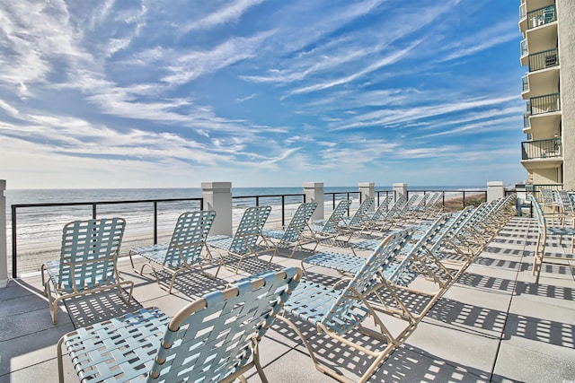 view of patio with a water view