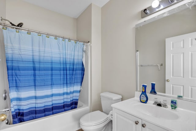 full bath with shower / bath combo, toilet, and vanity