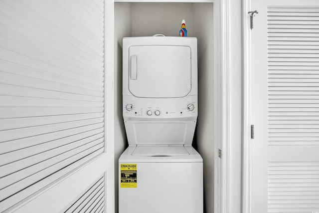 laundry room featuring laundry area and stacked washer / dryer