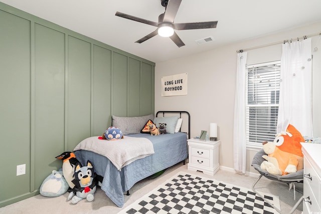 bedroom featuring ceiling fan, visible vents, and baseboards